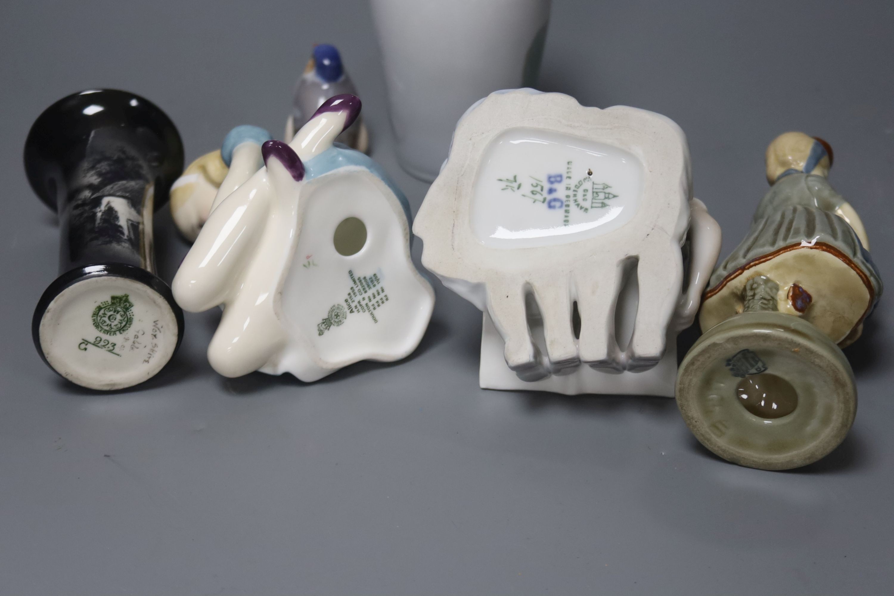 A group of figurines to include Royal Copenhagen, Doulton etc., a Royal Copenhagen vase and a Royal Worcester vase, 16cm